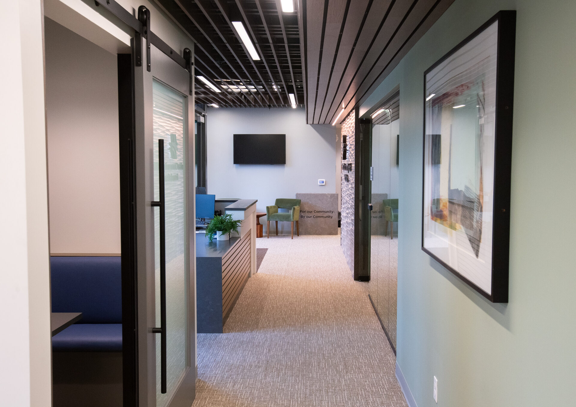 Circulation corridor with mirrored panel and donor recognition wall
